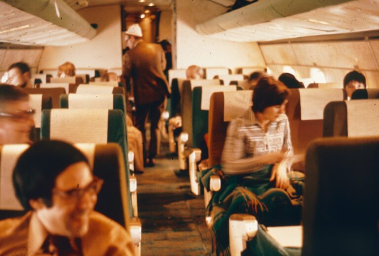 A group of people sitting inside of an airplane