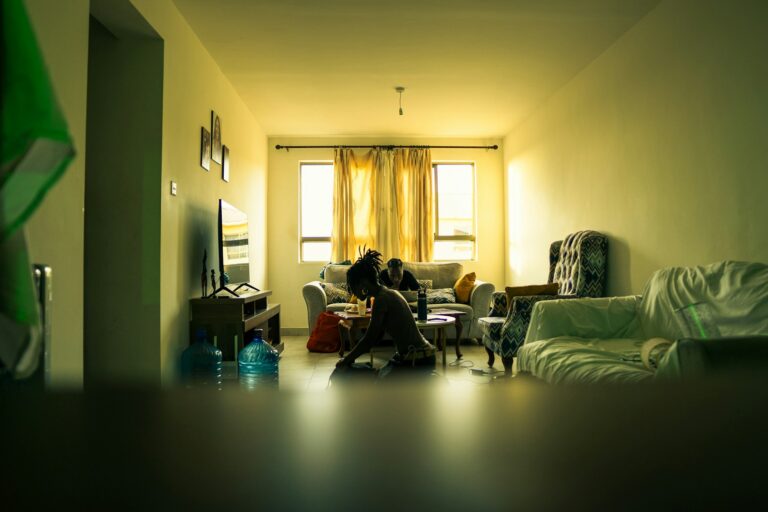 People in a living room with warm lighting