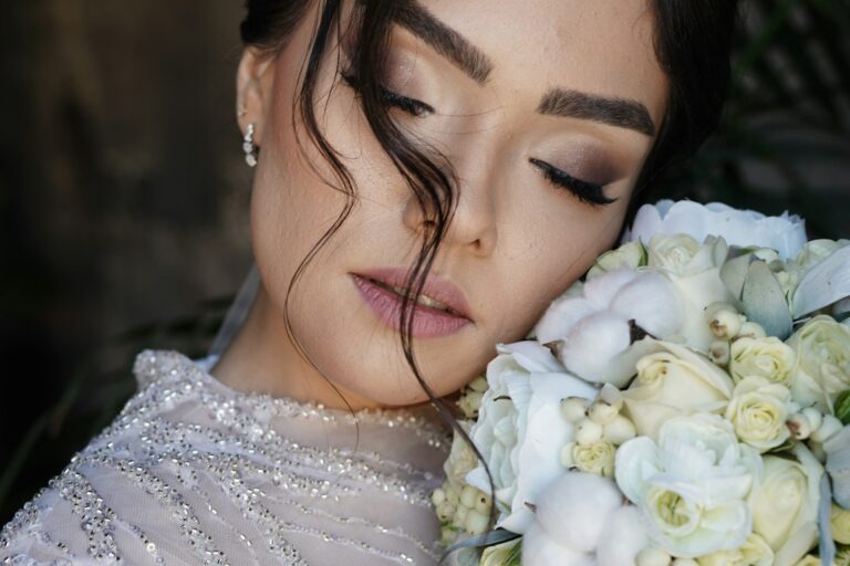 A woman holding a bouquet of white flowers