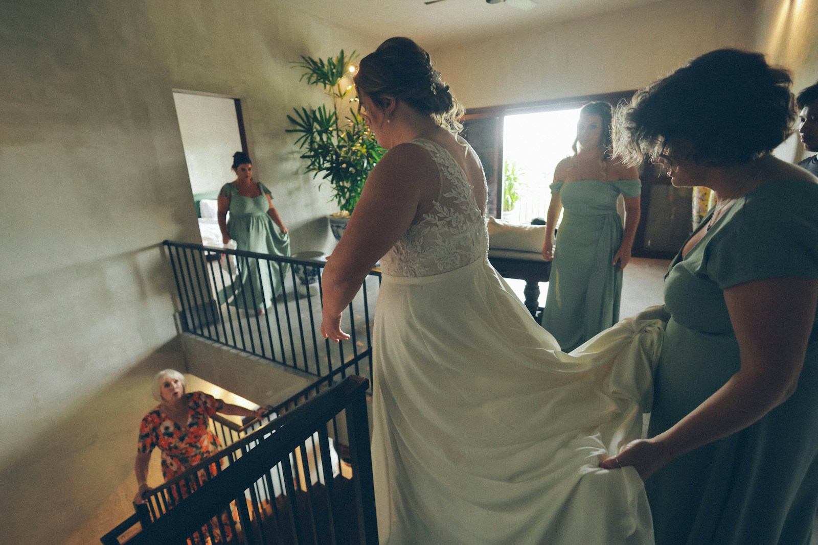 Bride and bridesmaids on staircase
