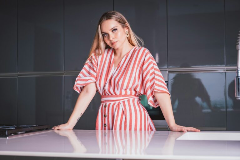 woman in red and white stripe dress