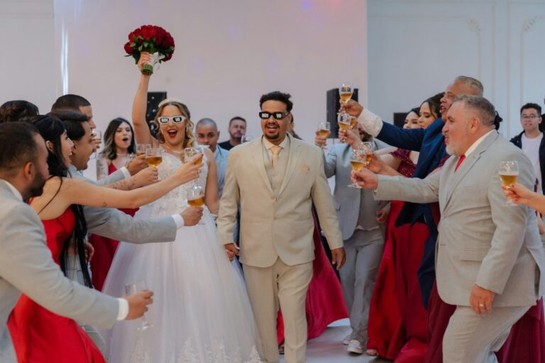 Newlyweds celebrated with guests toasting champagne.