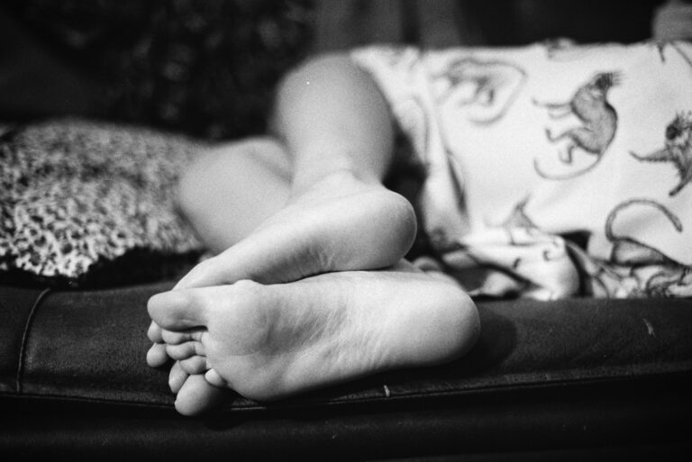 a person's feet on a couch