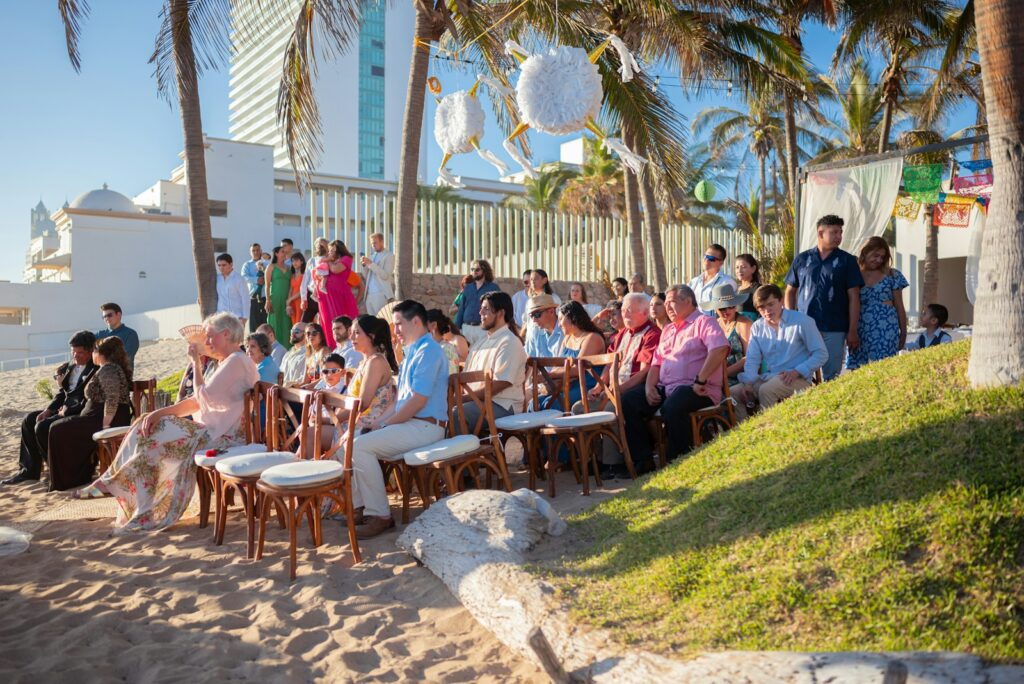 People gathered for a beach wedding ceremony.