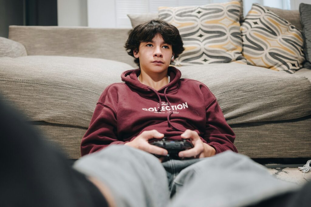 A young boy is playing a video game.