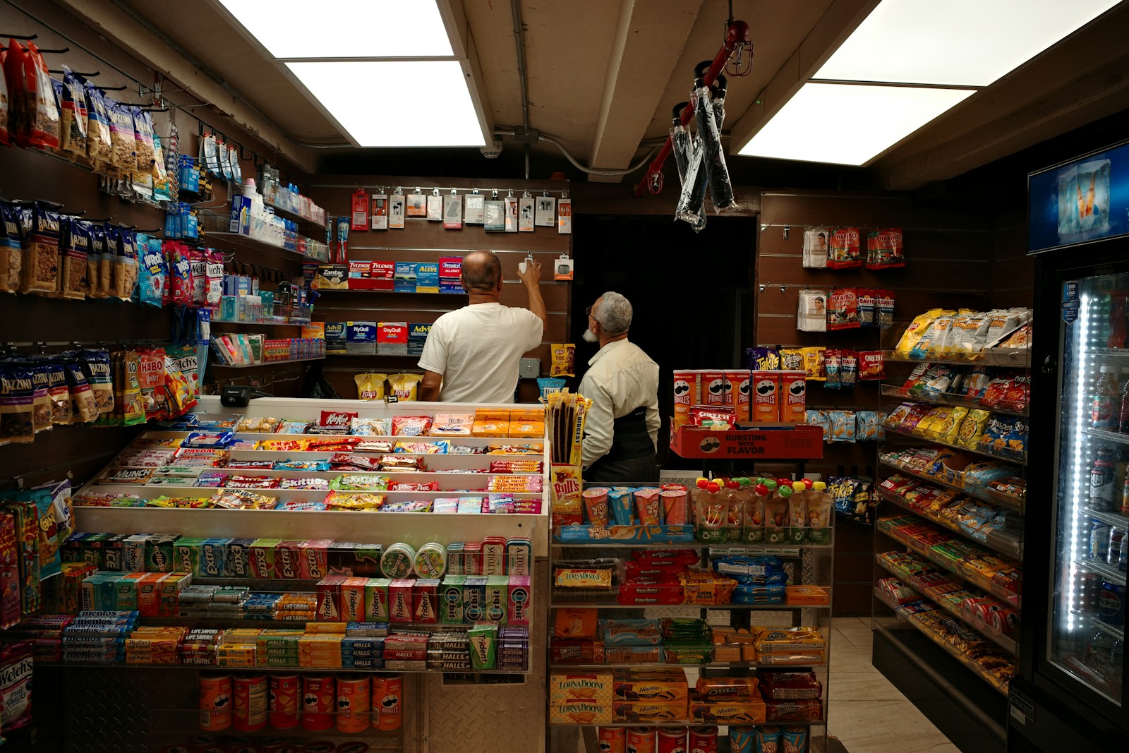 Inside a convenience store with snacks and drinks.