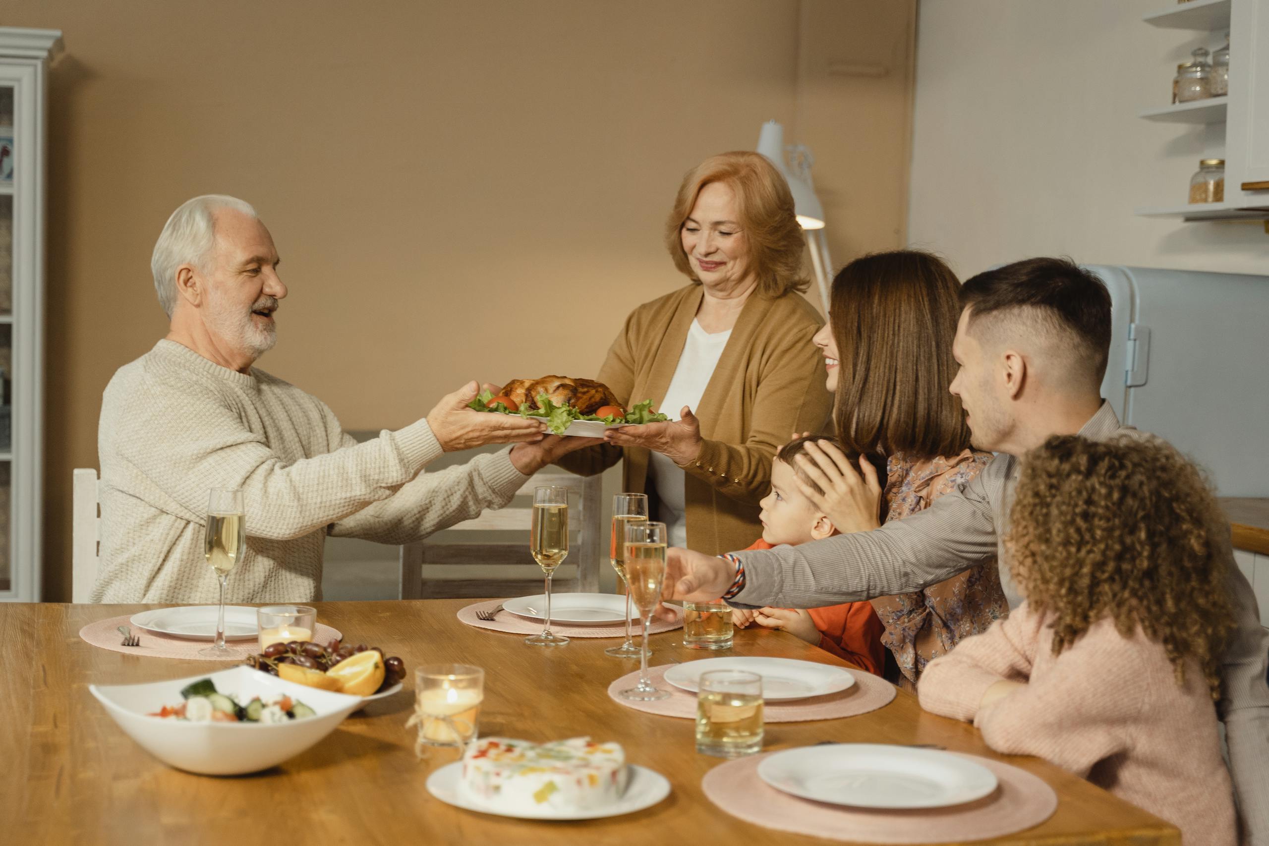 A family shares a joyful Thanksgiving dinner together at home.