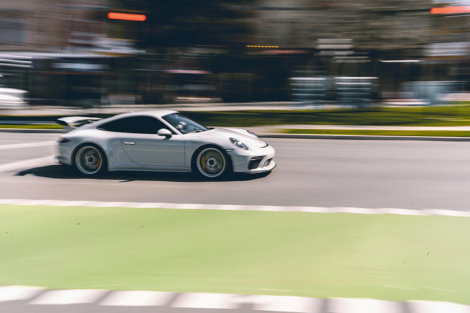 white porsche 911 on road during daytime