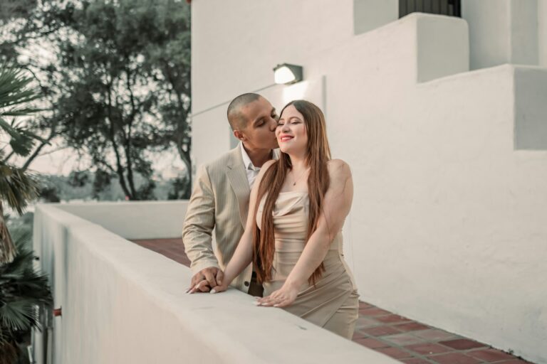 a man and a woman leaning against a wall