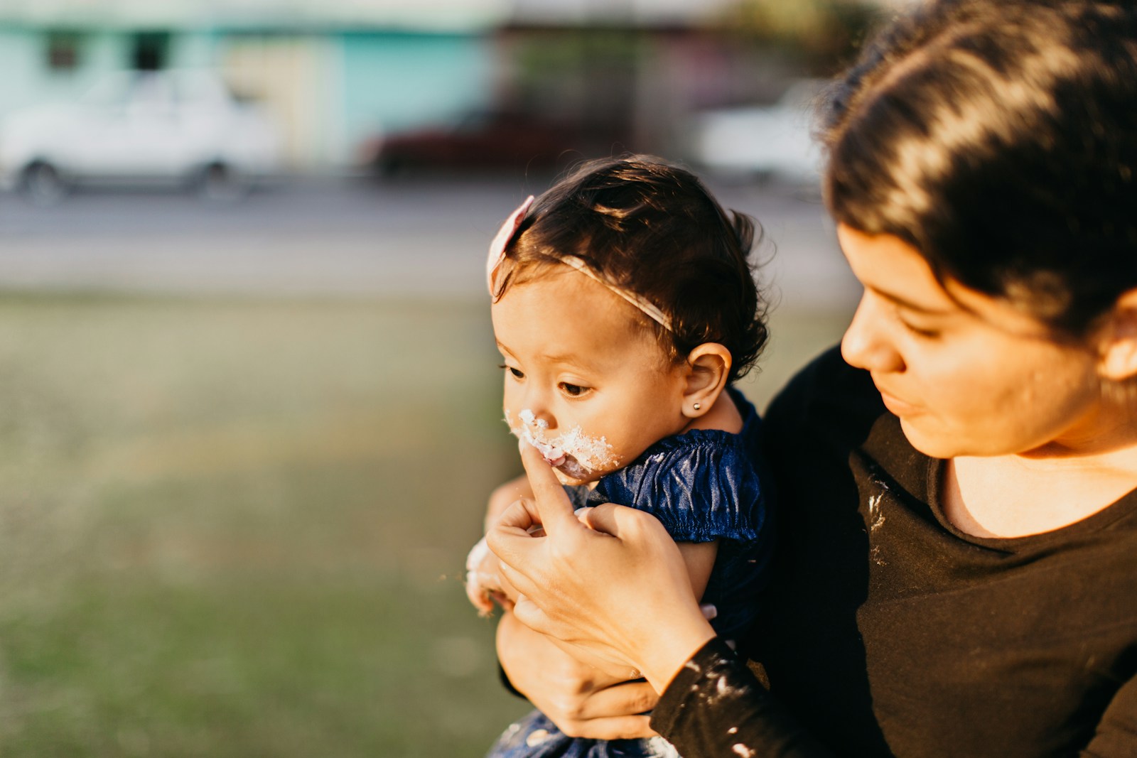 a woman holding a baby in her arms