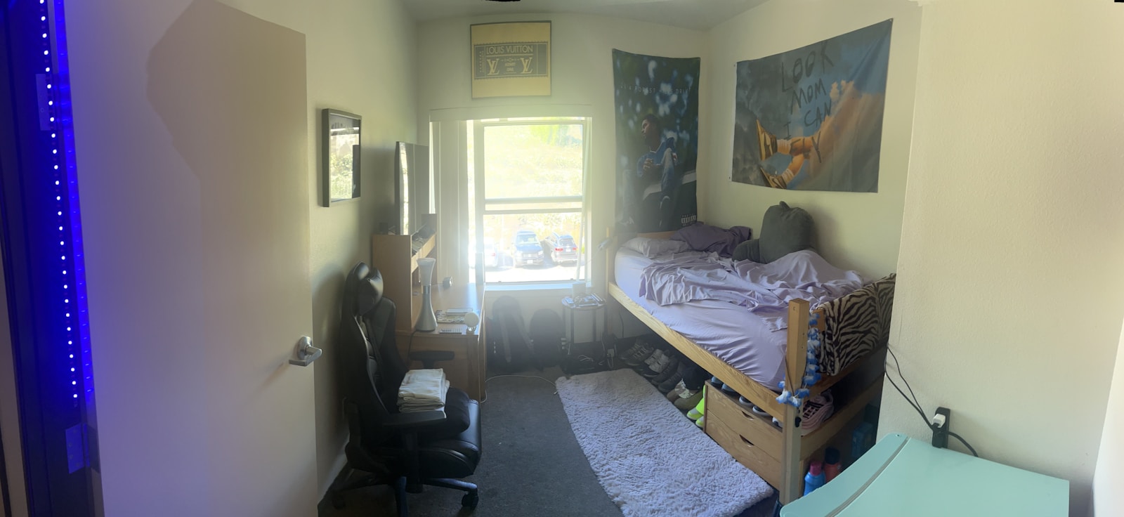 a bedroom with a bed and a desk in it