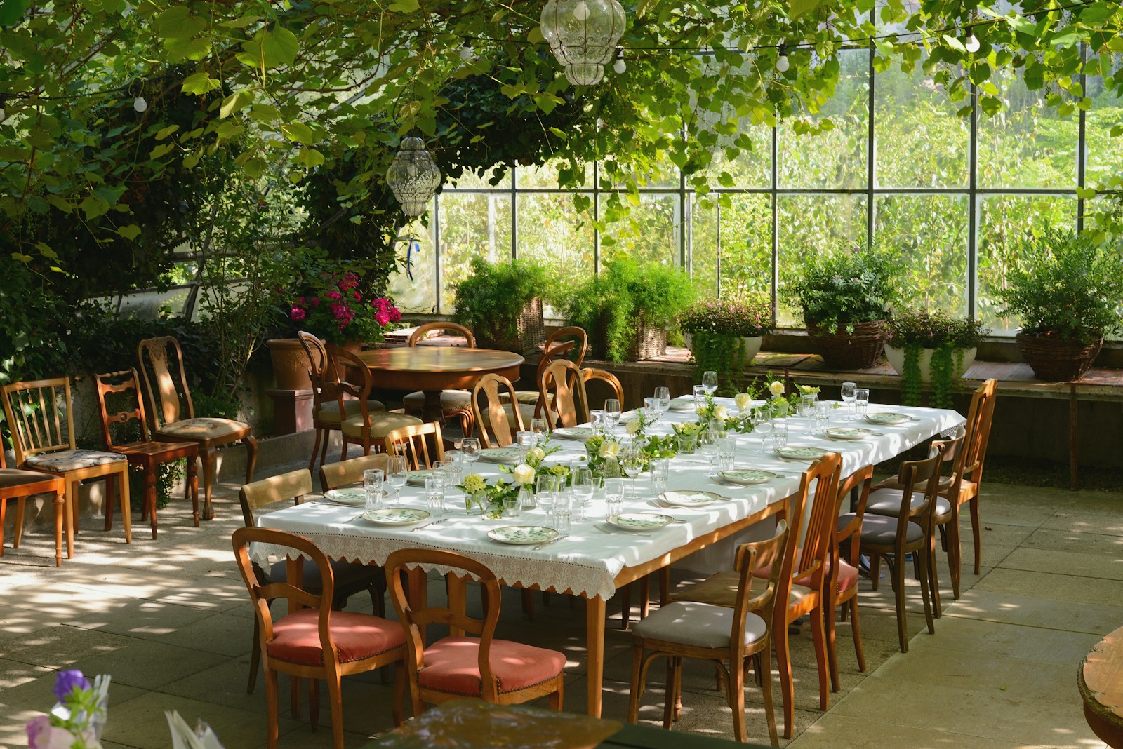 A dining room with a large table and chairs