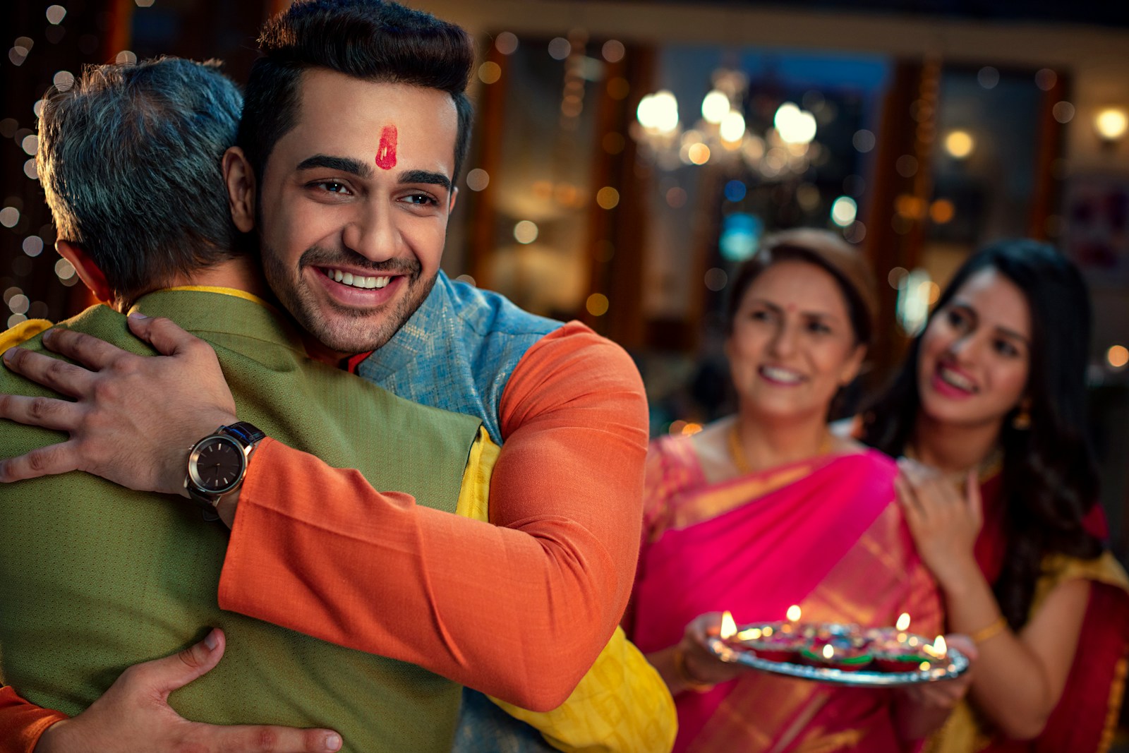 a man hugging a woman in front of other people