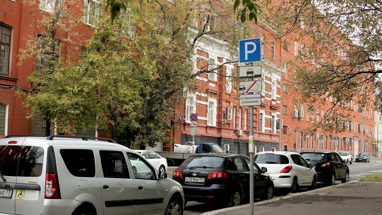 A row of parked cars on a city street