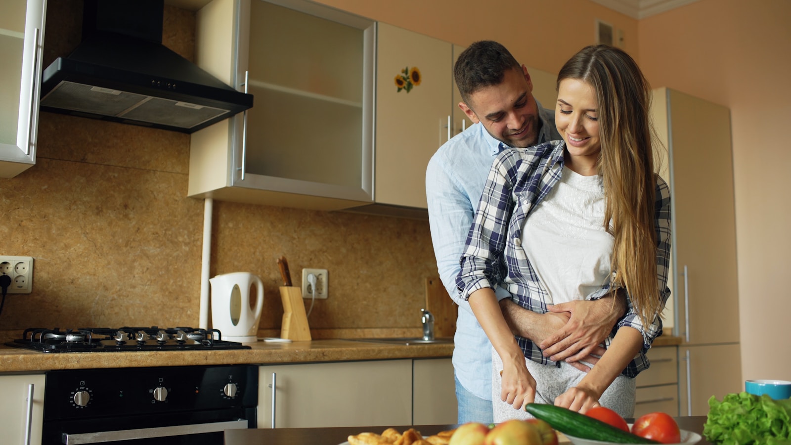 Couple cooking together in a modern kitchen