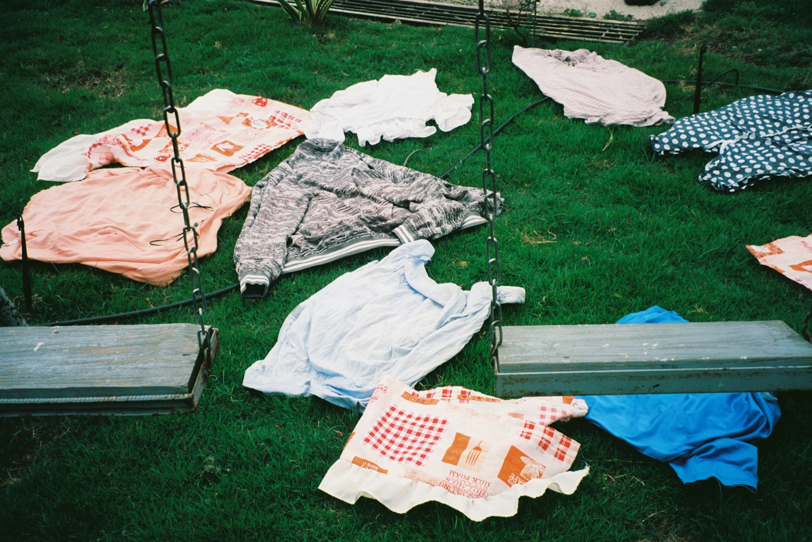 A bunch of clothes that are laying on the ground