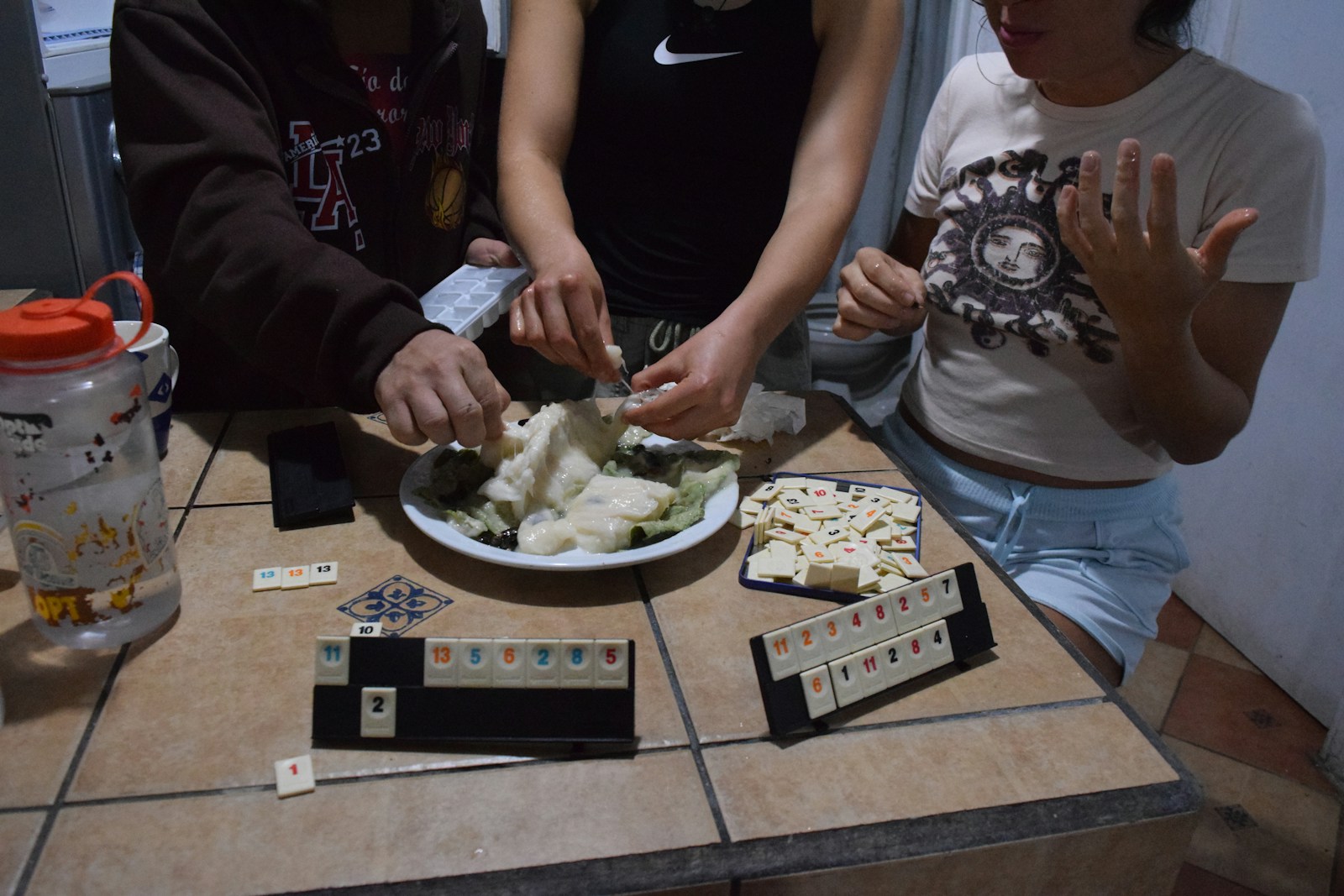 People play games and prepare food together.