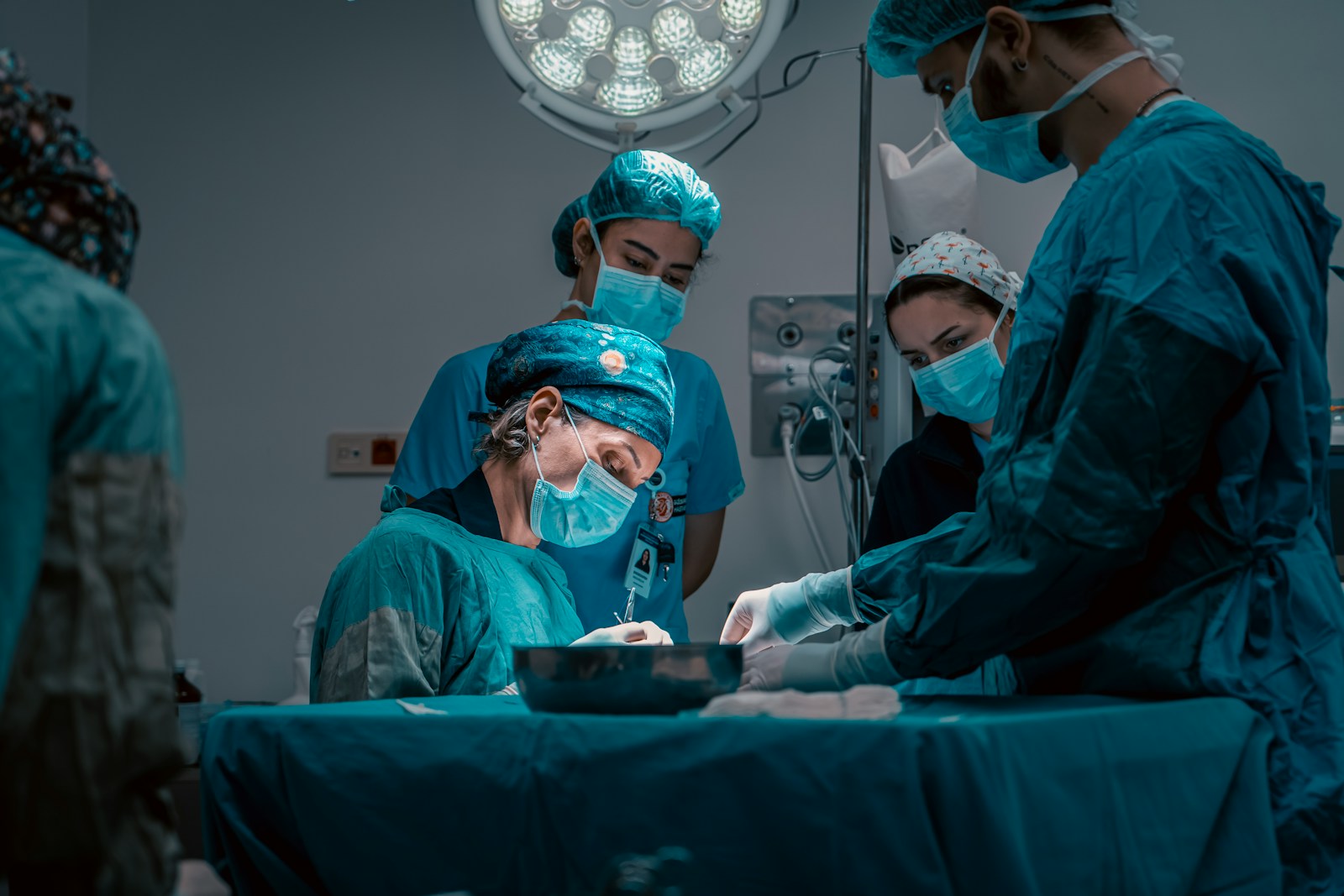 a group of doctors performing surgery on a patient