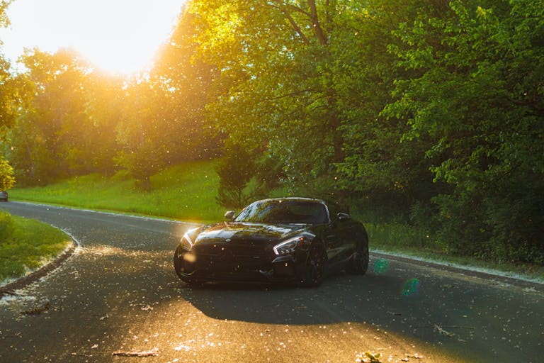 Black Mercedes-AMG GT on Road by Trees