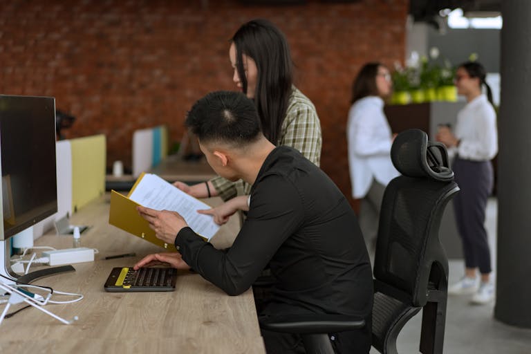 Diverse team collaborating in a modern office setting, enhancing productivity.