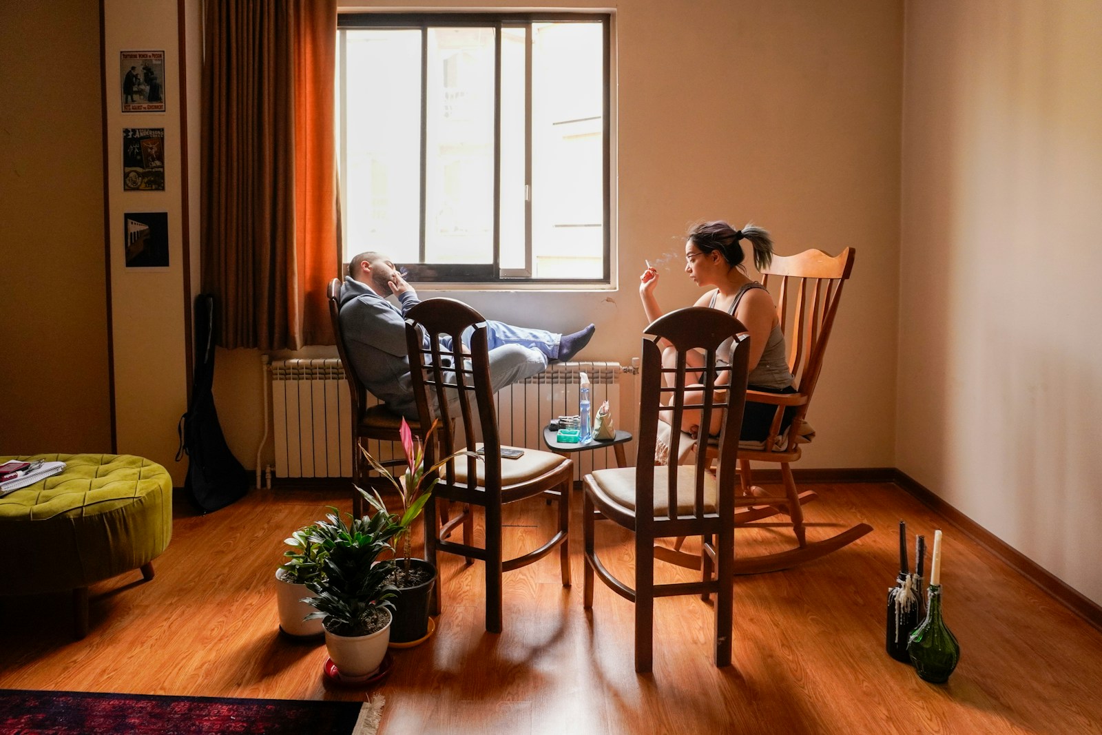 People relax in a cozy living room setting.