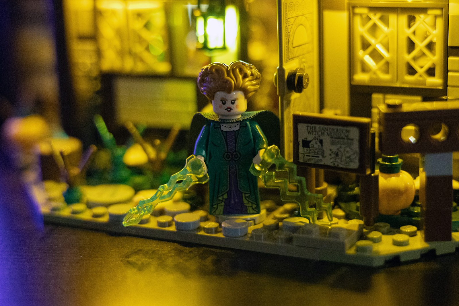 Lego figure with magical effects in a village setting.