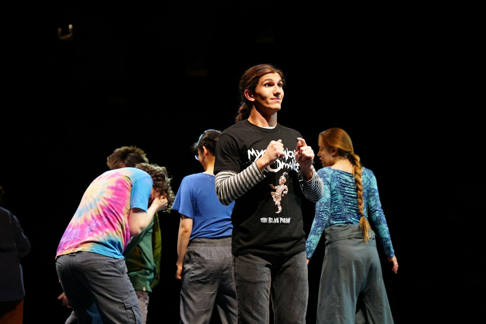 A group of people standing on top of a stage