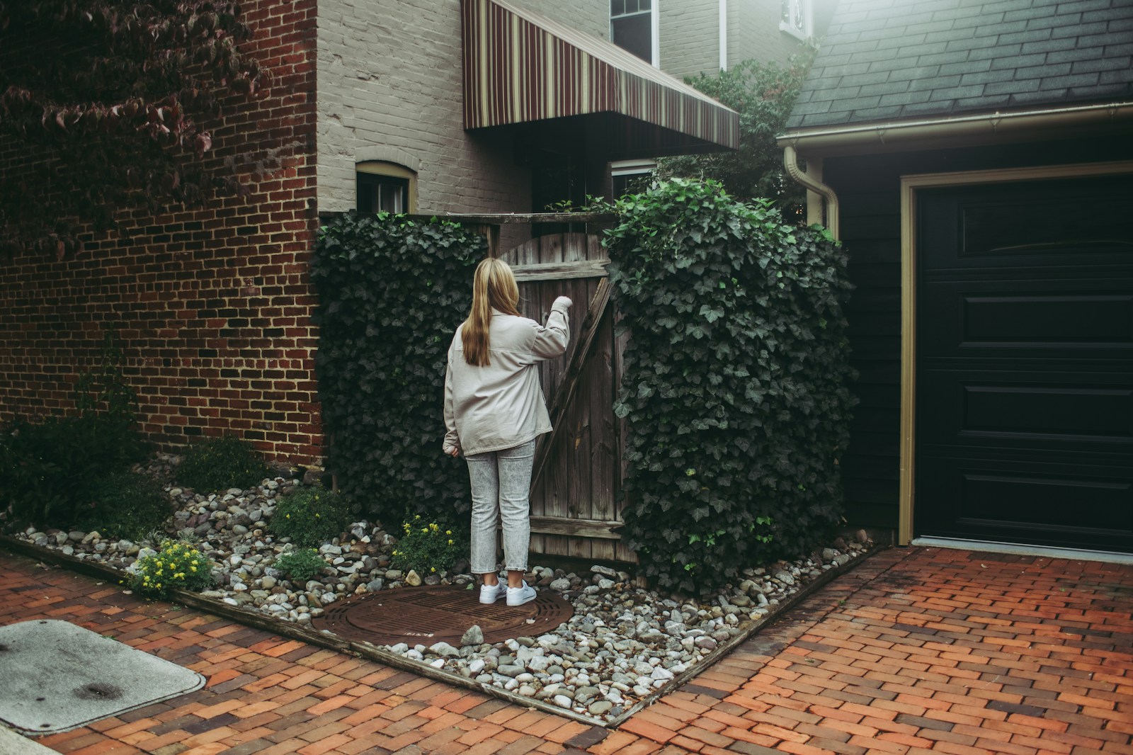 a person standing on a brick path