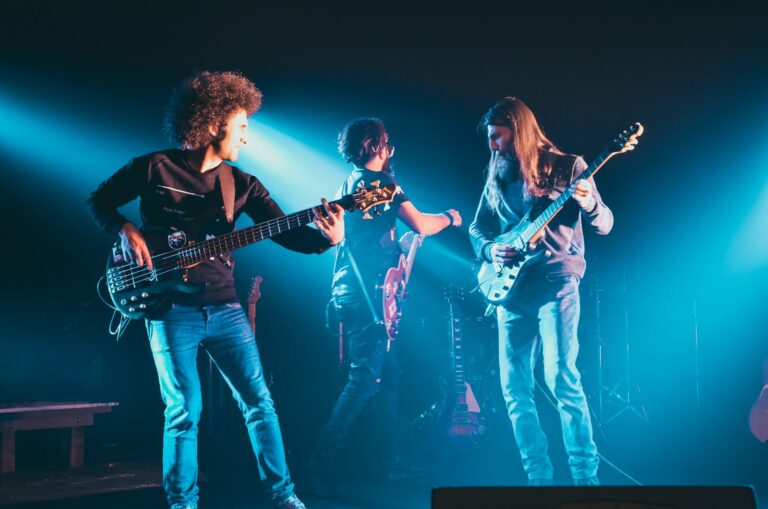 man and woman playing guitars