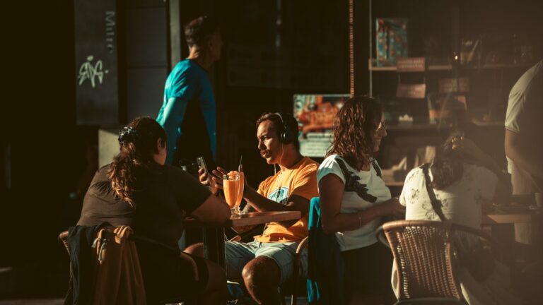 People enjoying leisure time at an outdoor café in Bariloche, Argentina.