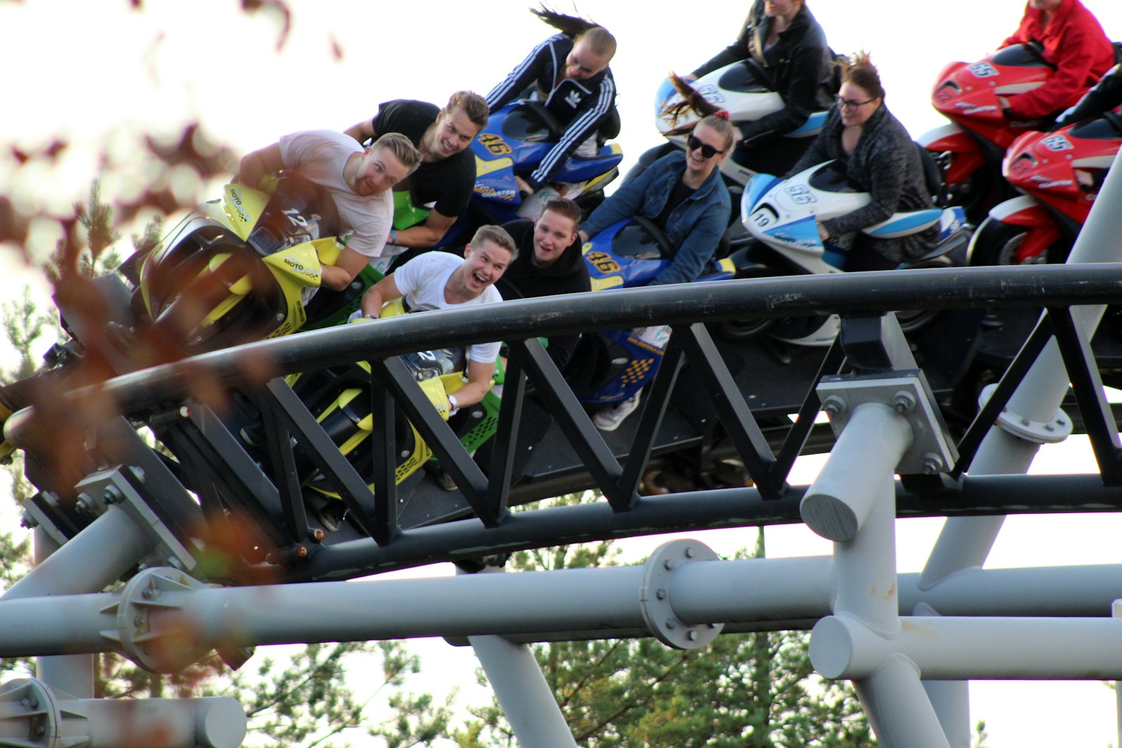 people riding roller coaste