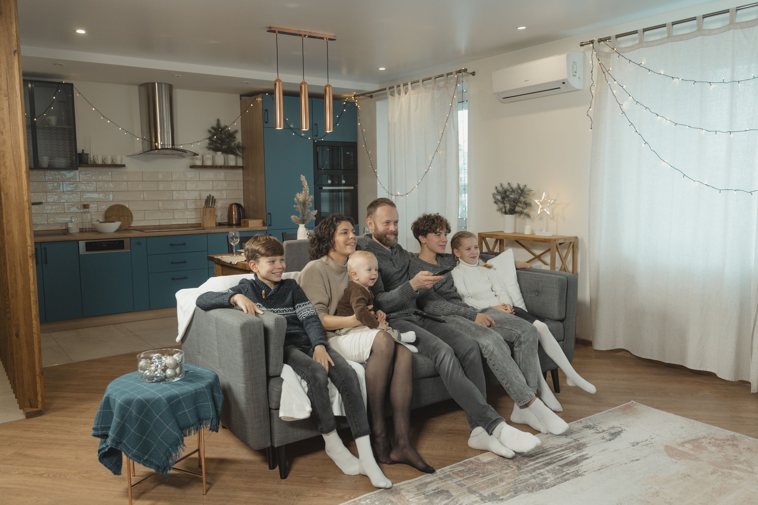 Happy family enjoying quality time together on cozy living room couch.