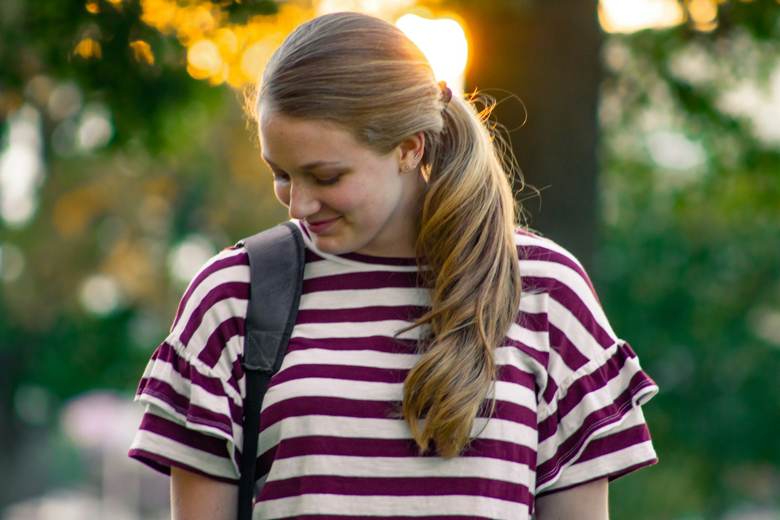 women's purple and white striped crew-neck shirt close-up photography