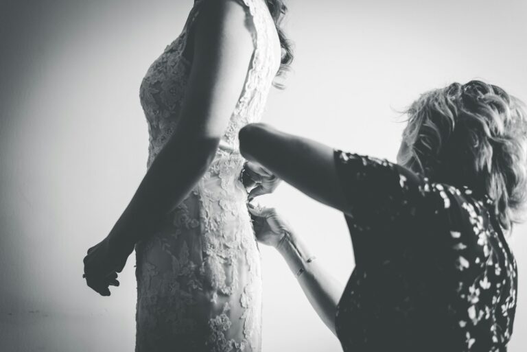 woman in black dress holding her hair