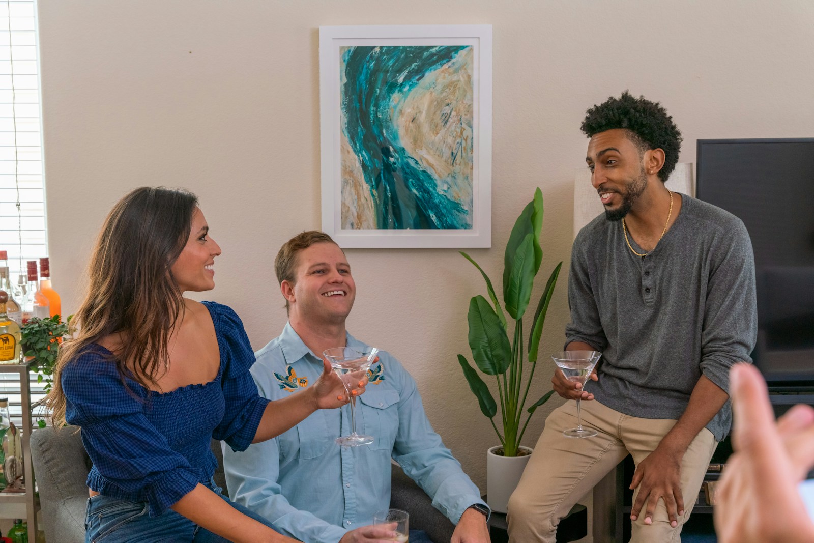 a group of people sitting around drinking wine