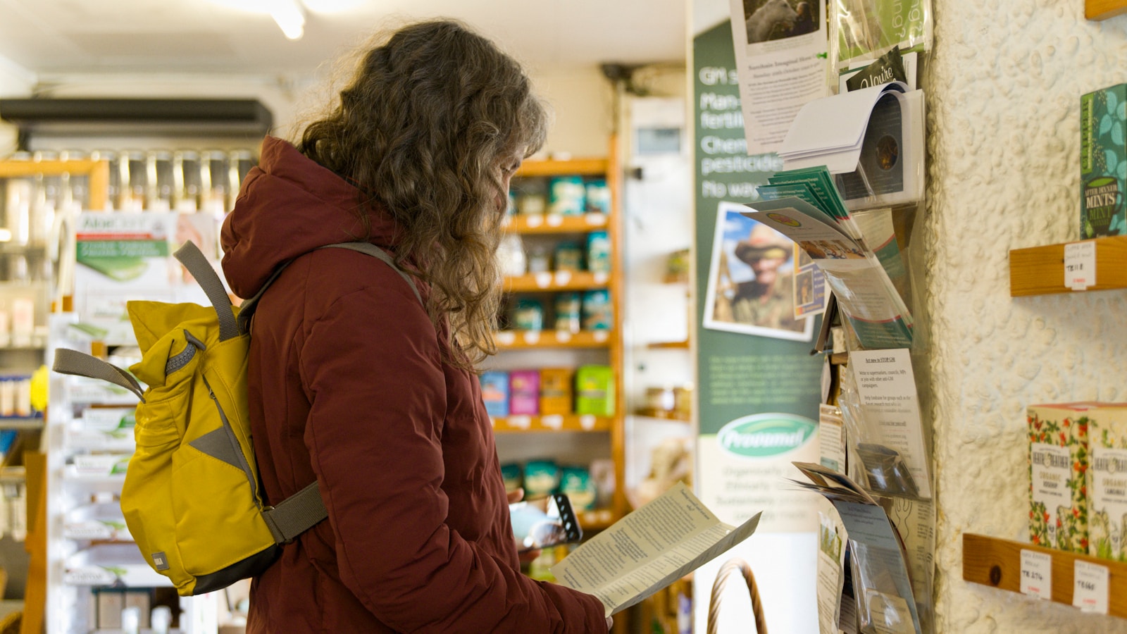 a woman in a store looking at a menu