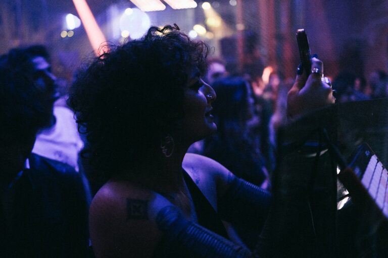 a woman taking a picture with her cell phone