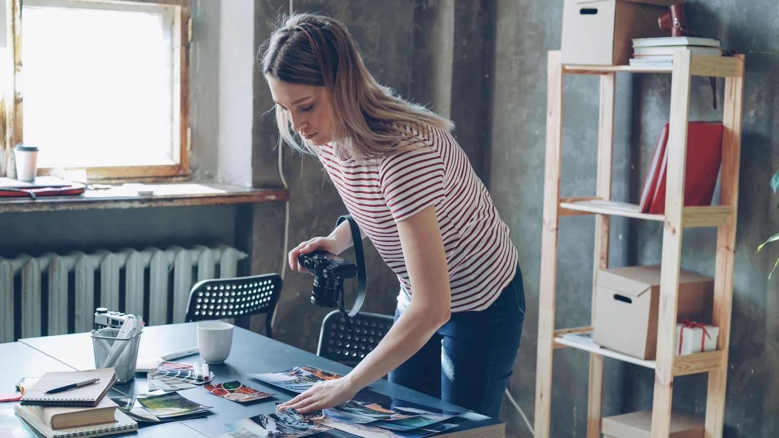 A photographer is working with her photos.