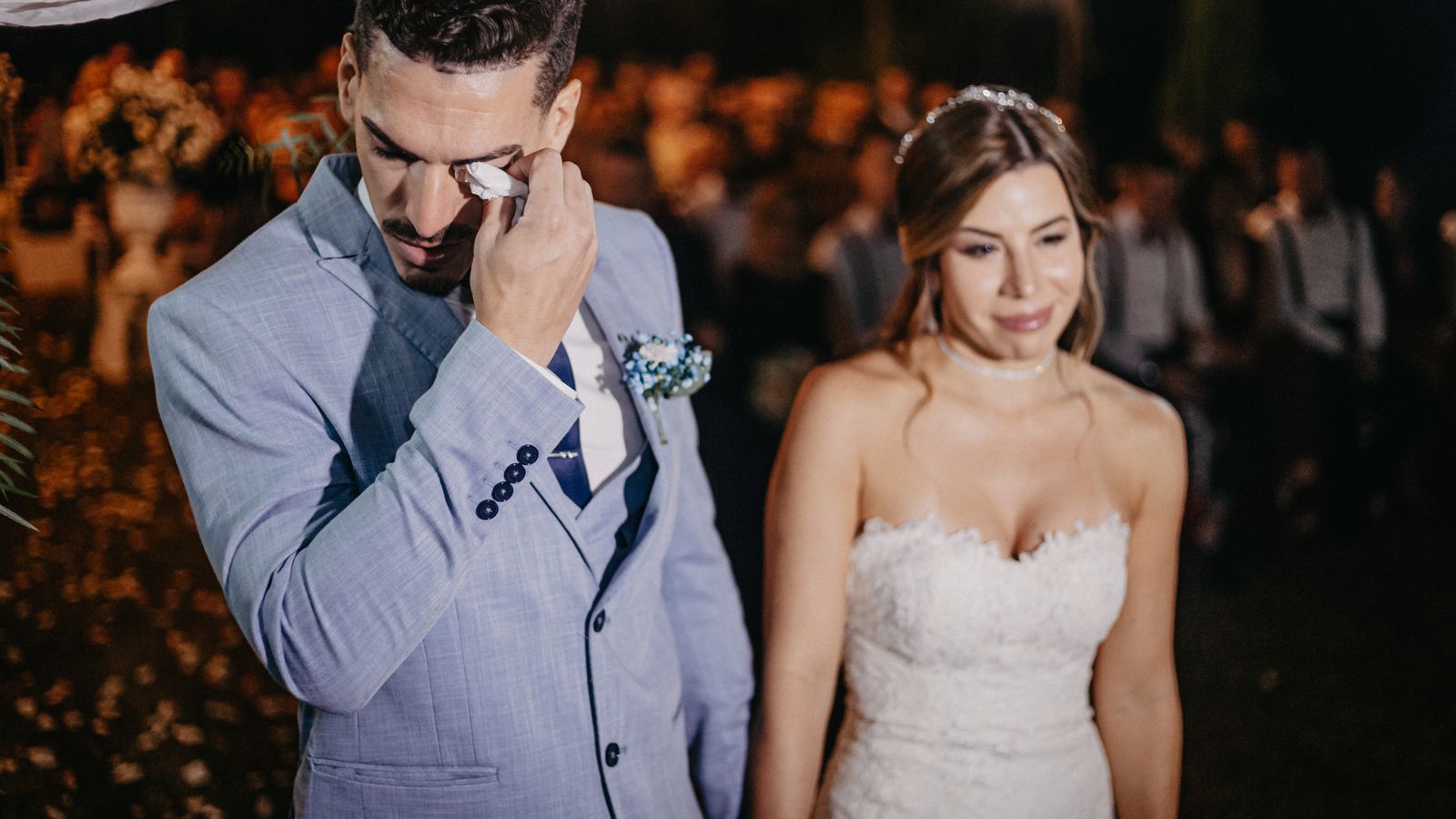 Bride and groom share an emotional moment during their wedding ceremony.