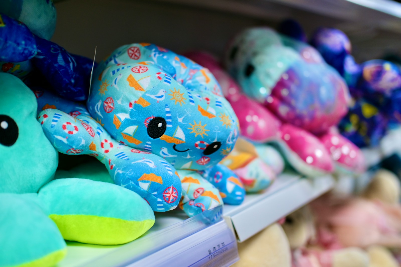 Colorful plush octopus toys on a shelf.
