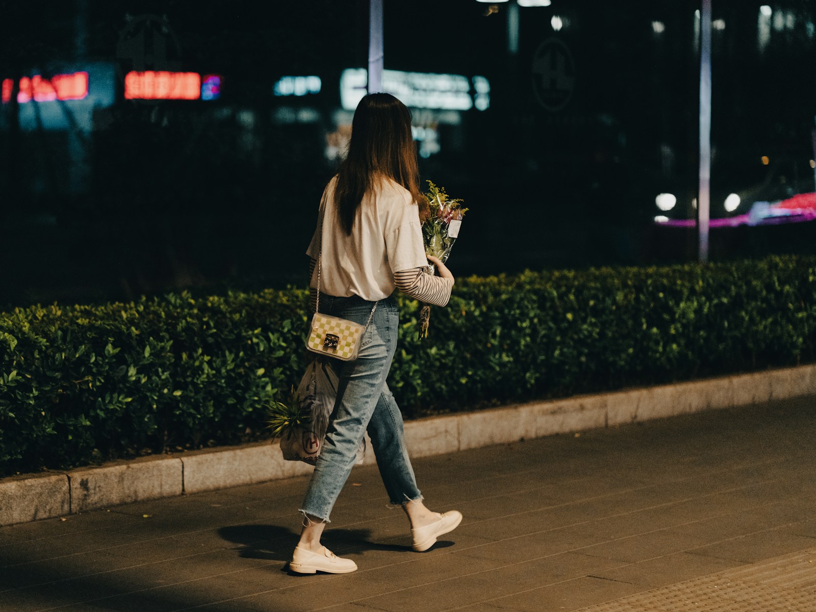 a person walking on a sidewalk