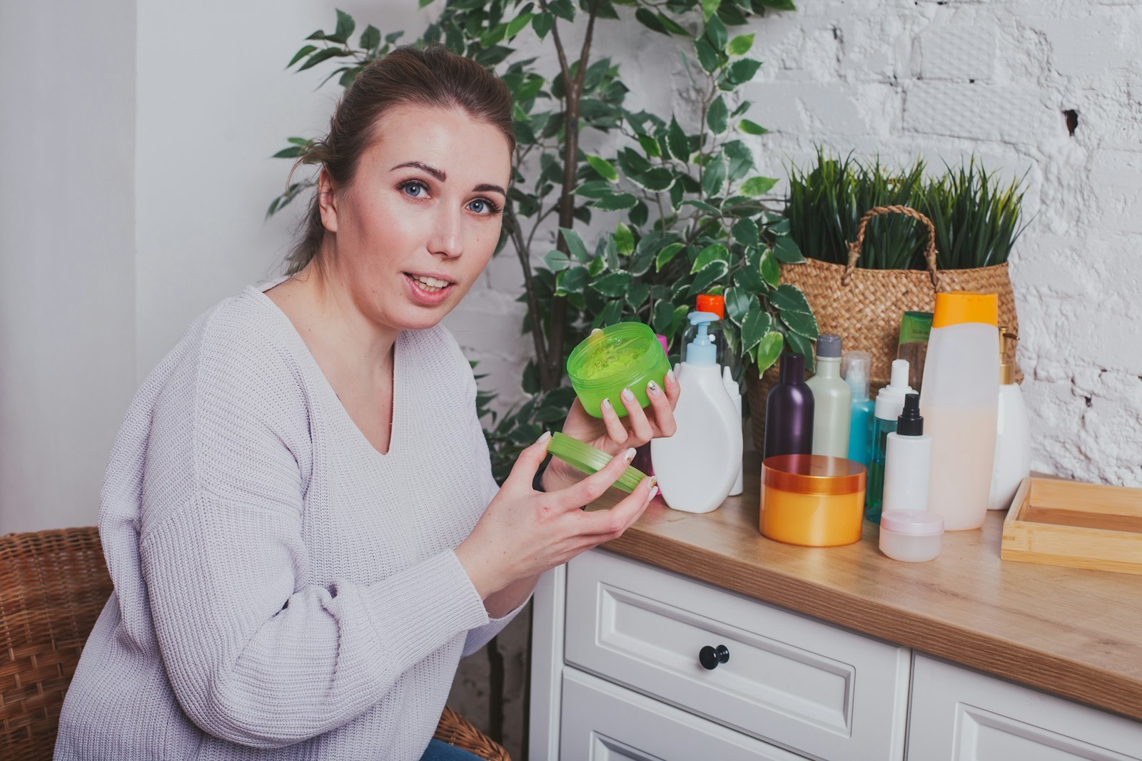 a woman holding a green pepper