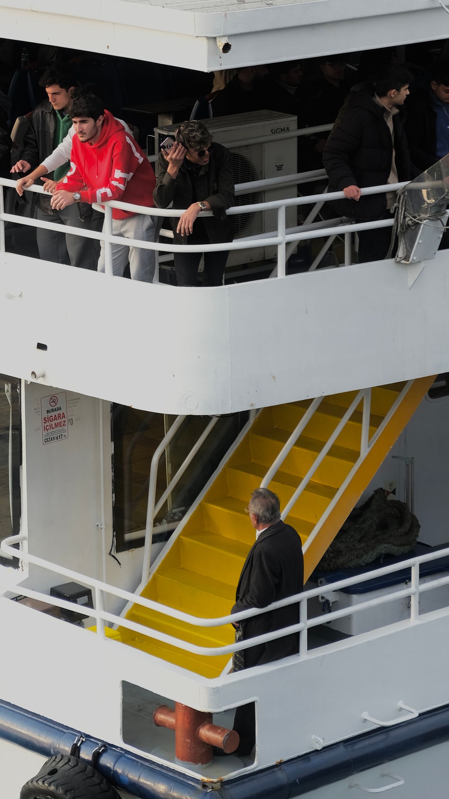 People enjoying views from a cruise ship deck, reflecting the record cruise demand CLIA reported for 2025.