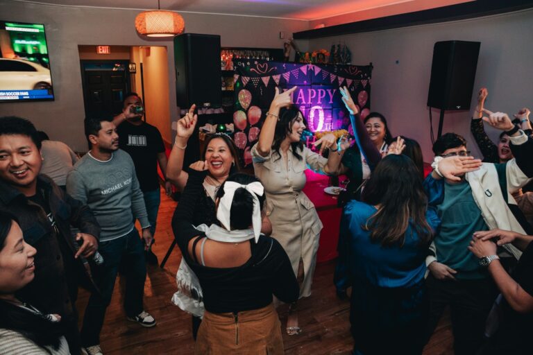 A group of people dancing in a room