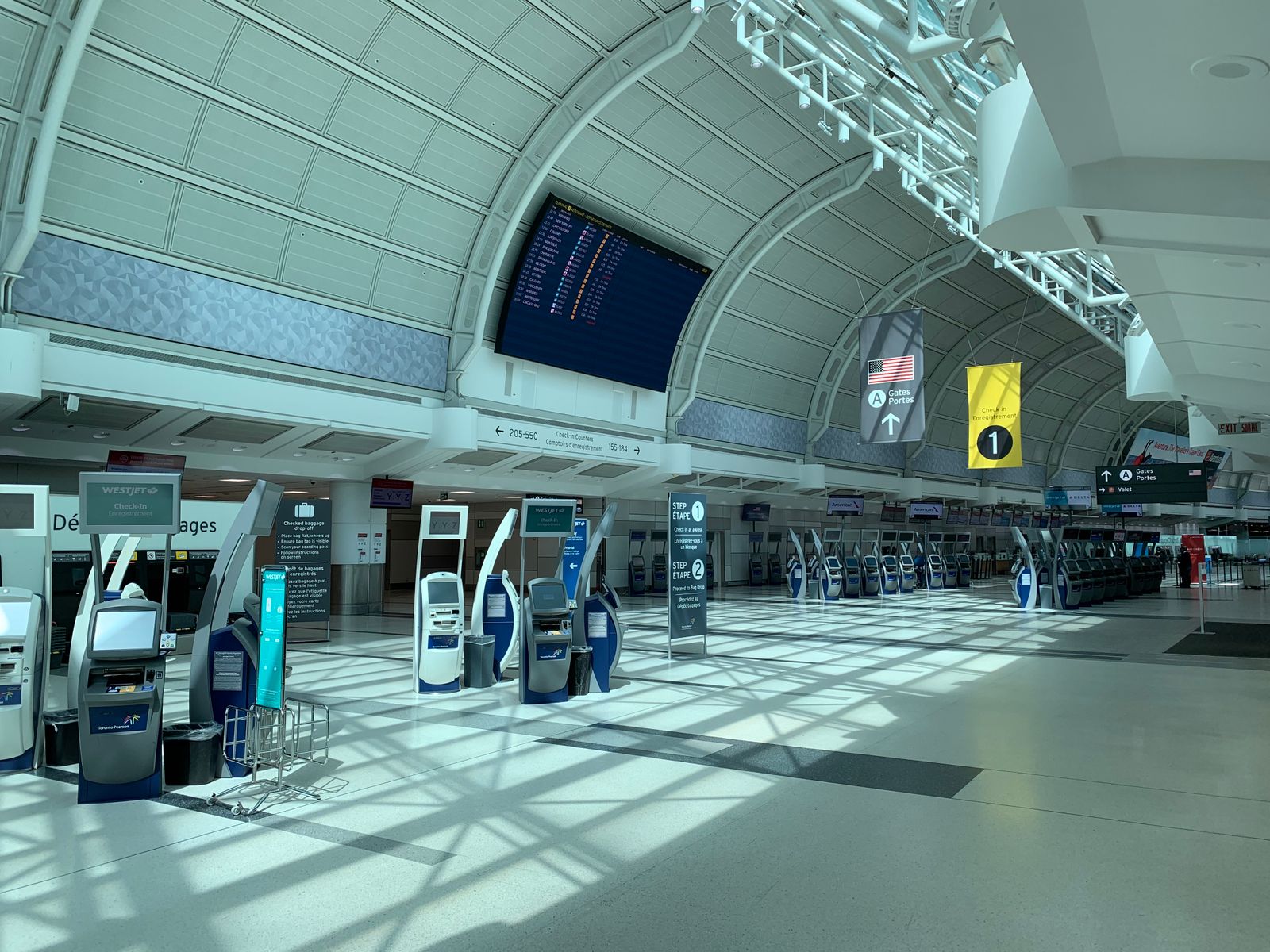 Creative design interior of contemporary airport with corridor under information board and signboards