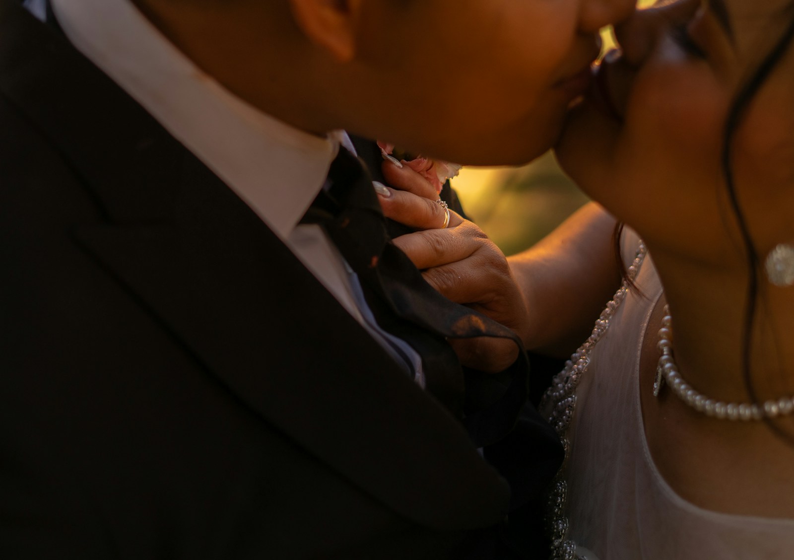 A bride and groom share a tender kiss