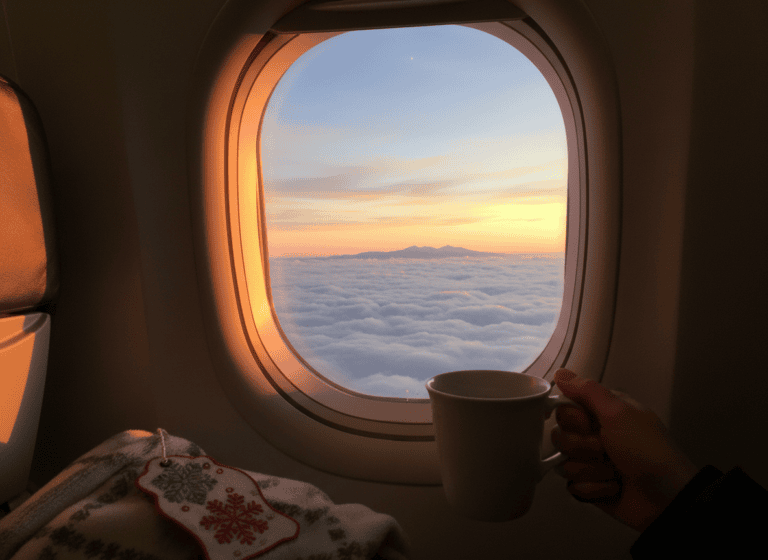 View of a winter sunset sky through an airplane window