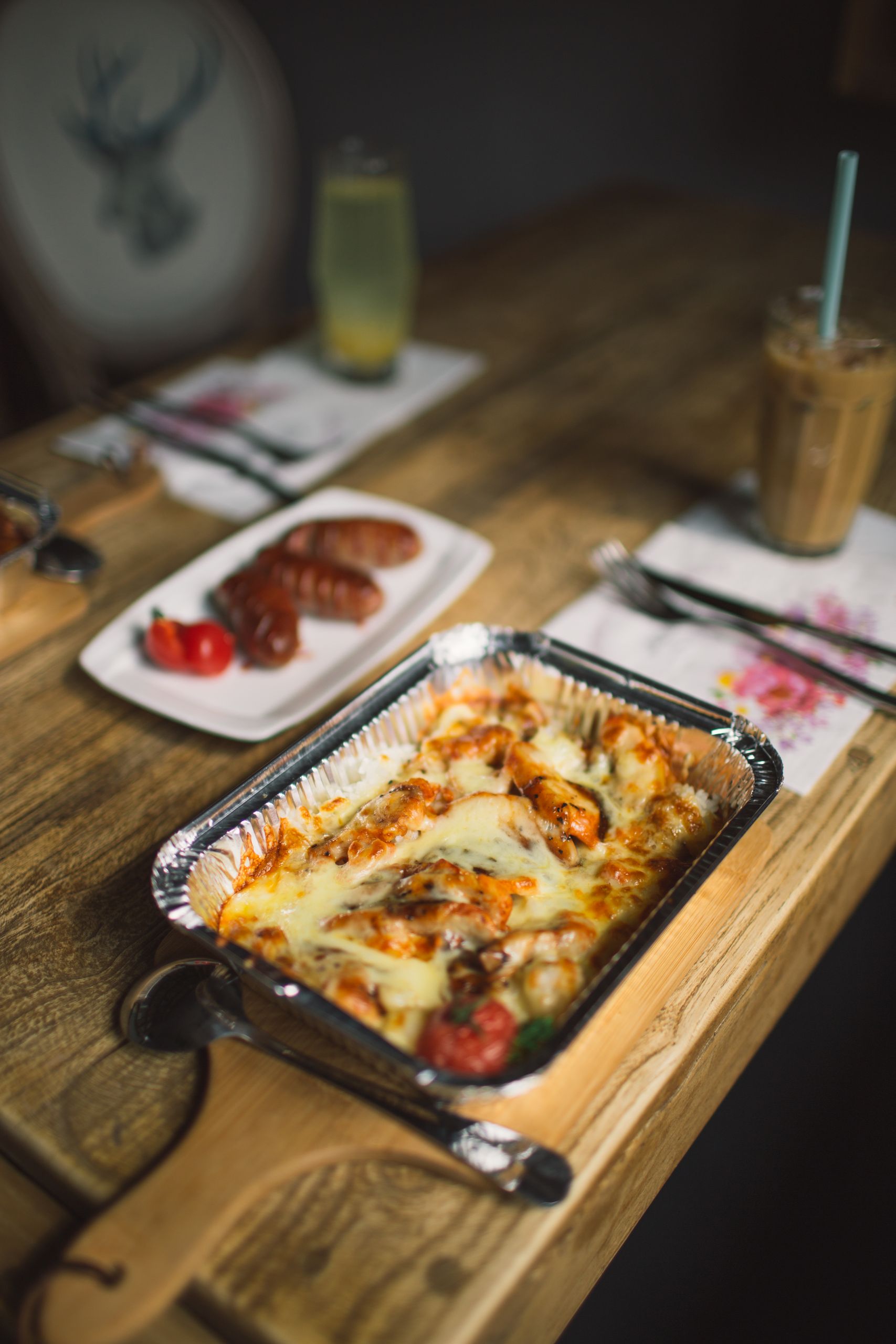 A delicious cheesy casserole served in a cozy setting. Perfect for dinner or lunch gatherings.