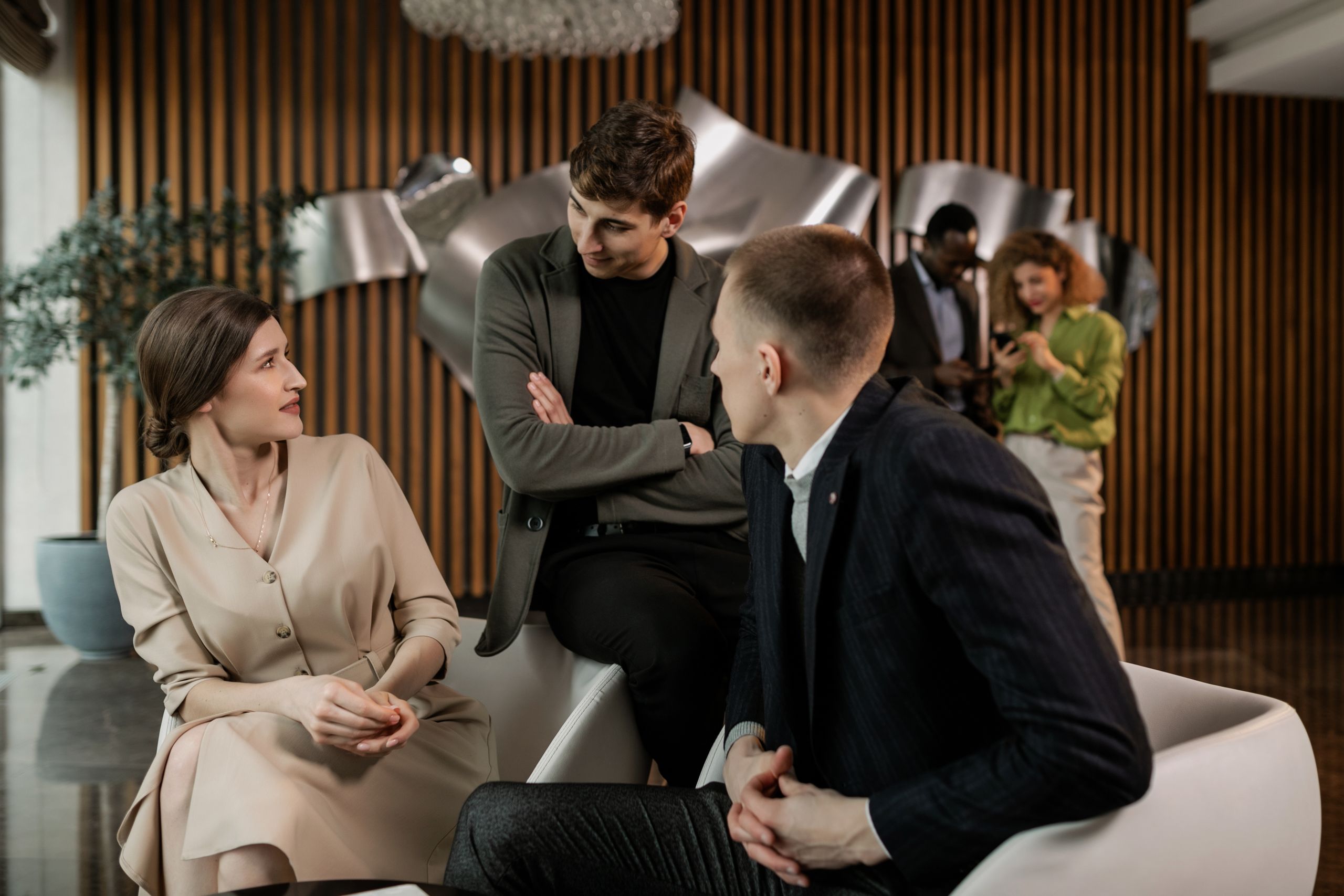 Group of professionals having a collaborative meeting in a modern office setting.