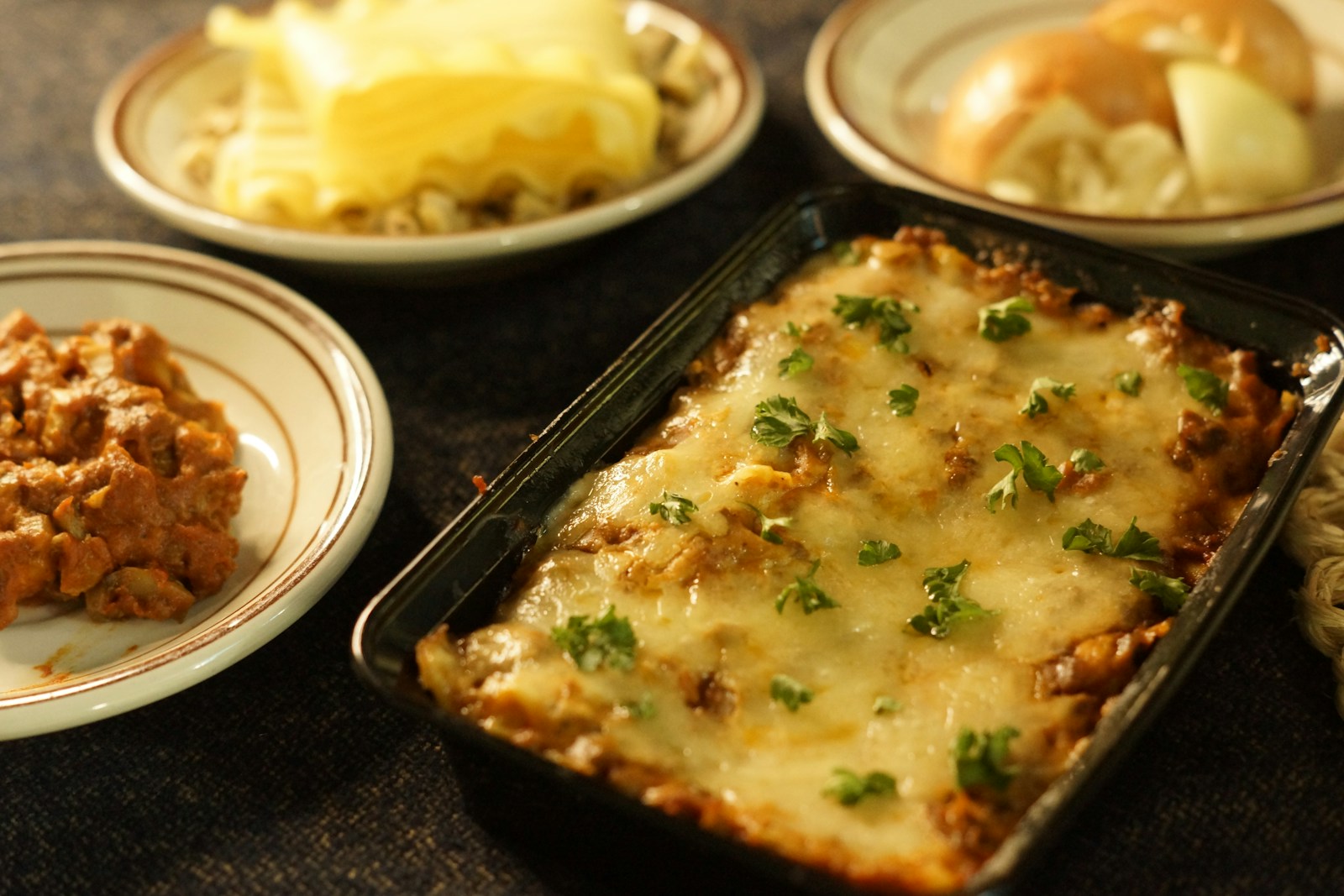 a casserole dish with meat and vegetables on a table